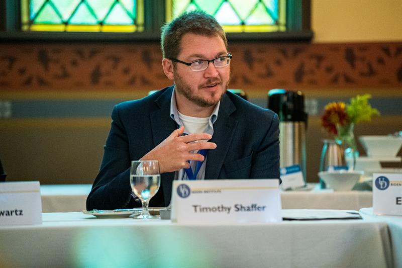 Timothy Shaffer seated at a table, speaking.