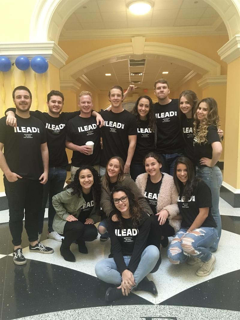 Students pose in ILEAD shirts