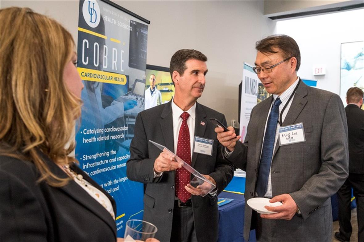 UD Day in DC attracted leaders from federal agencies that support UD research. Here, Steven Stanhope (center), associate vice president for research at UD and director of Delaware INBRE, talks with Ming Lei of the National Institutes of Health.