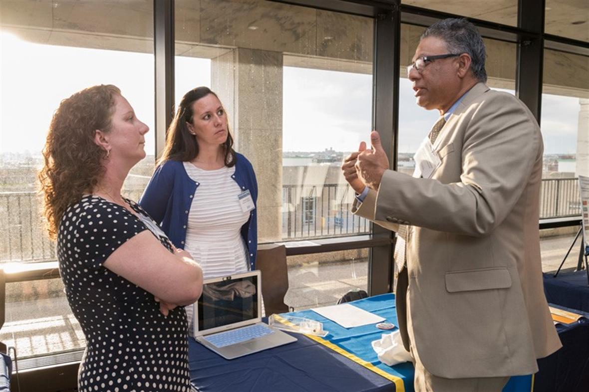 University of Delaware researchers Jen Biddle (left) and Danielle Dixson of Marine Biosciences in the College of Earth Ocean and Environment talk with Anshuman A.R. Razdan, associate vice president for research development at UD.