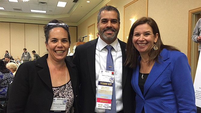 UD's Martha Narvaez (right) passed the AWRA presidential gravel to incoming president Rafael Frias III.