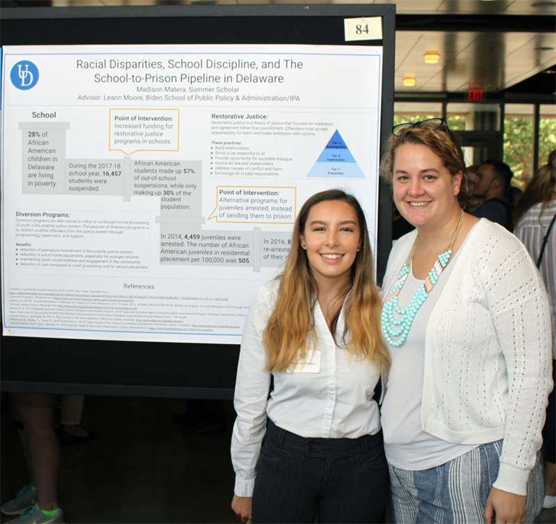 Madison Matera with staff mentor Leann Moore during her poster presentation.