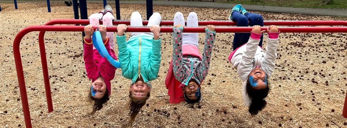 Children hanging on playground